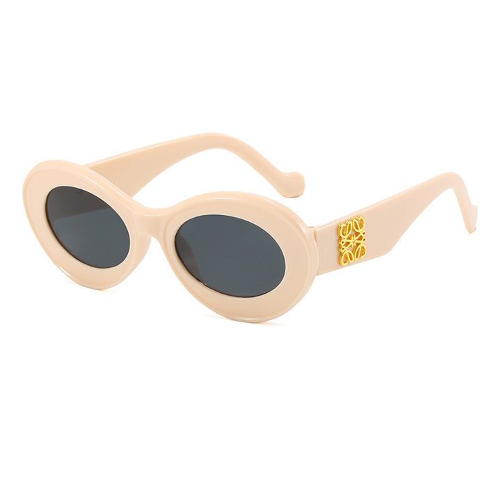 Women's fashionable sunglasses with oval frame and golden applications Bowlift