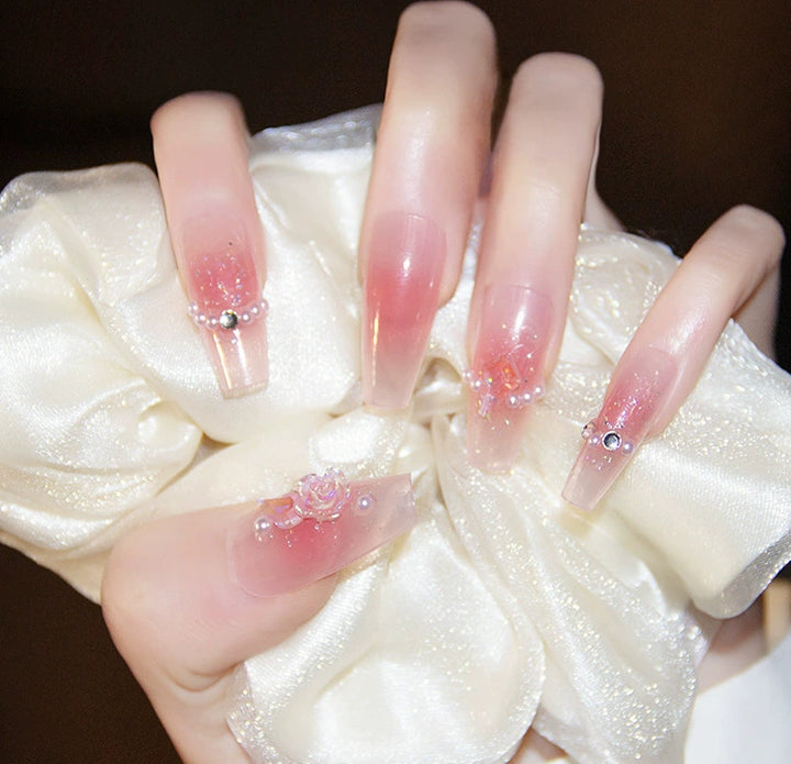 Elegant nail design with pearl embellishment Bowlift