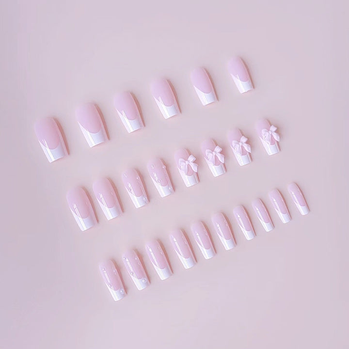 Artificial nail set with elegant bow and pearl decorations Bowlift