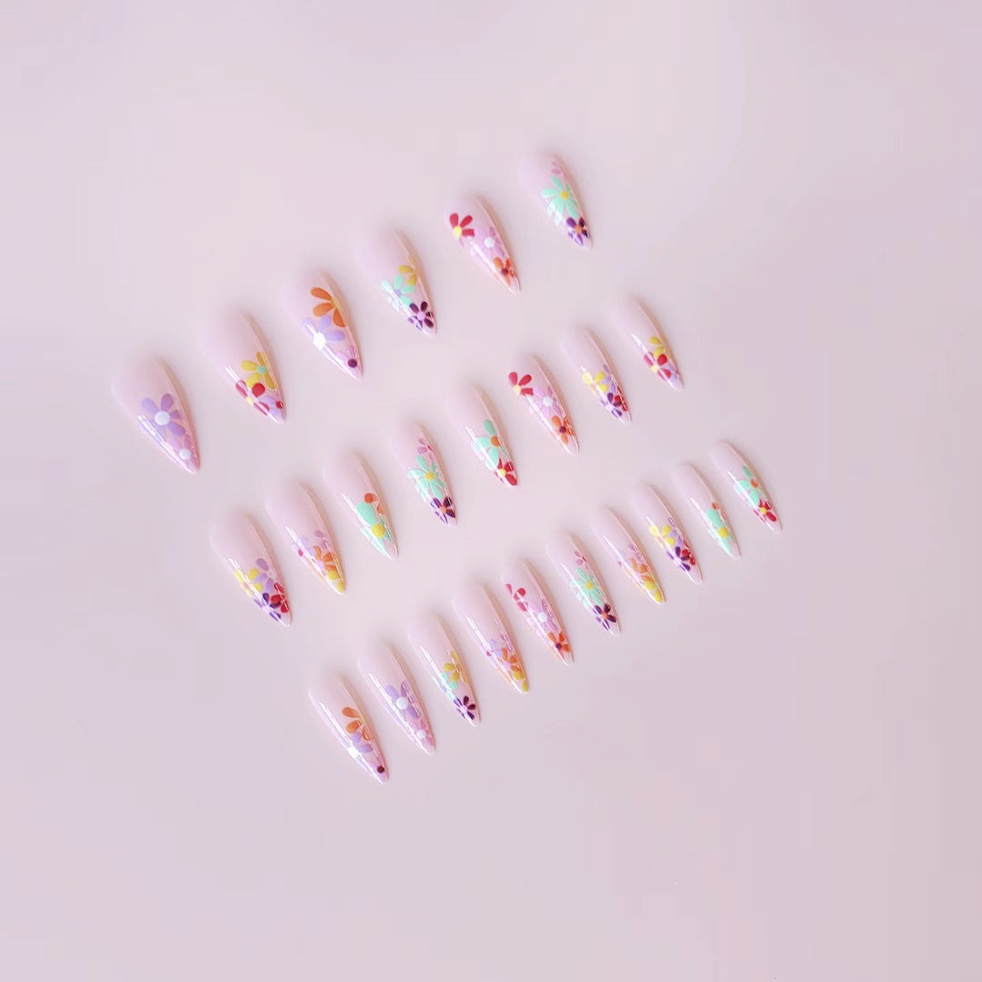 Acrylic nail set with vibrant floral designs and sharp accents Bowlift