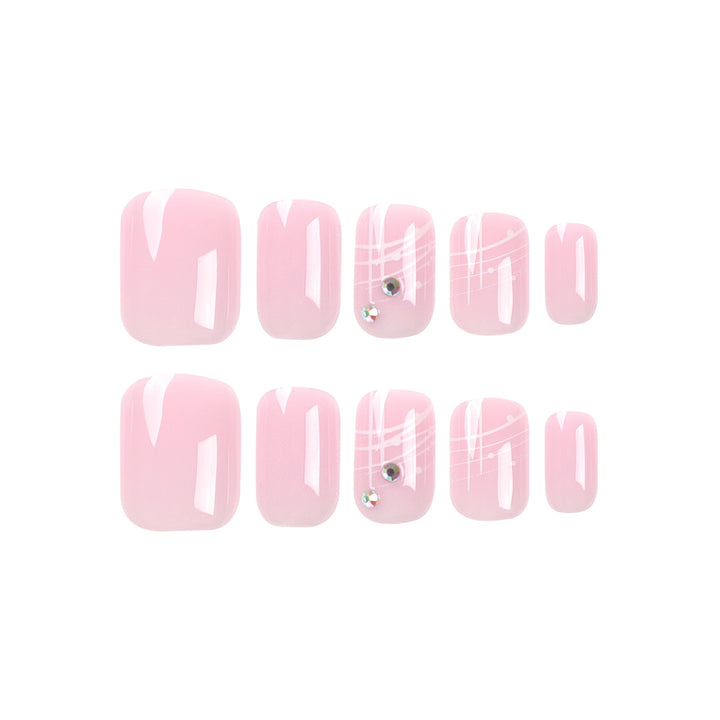 Artful nail extensions with elegant design and rhinestone embellishments Bowlift