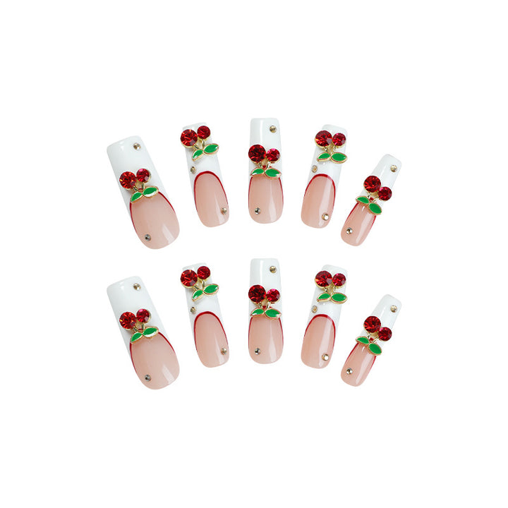 Artificial nail set with cherry motif and sparkling rhinestones Bowlift