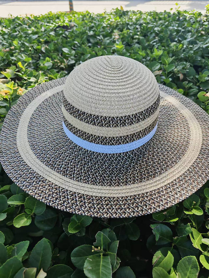 Elegant sun hat with wide brim and subtle stripe pattern Bowlift