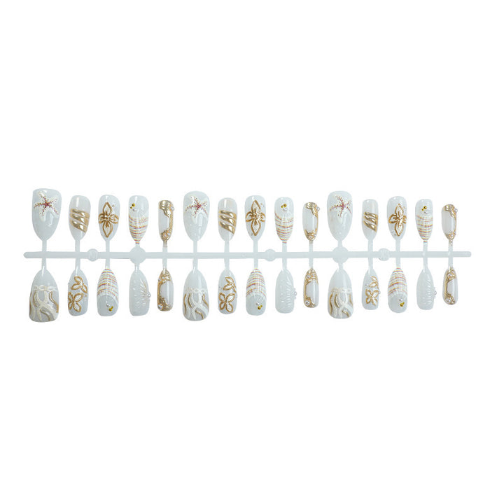 Artificial nail set with luxurious gold embellishments and elegant natural motifs Bowlift