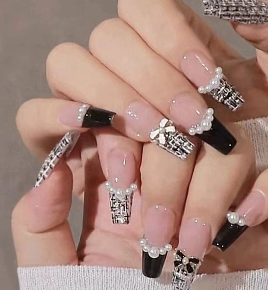 Elegant nail design with pearl embellishment Bowlift