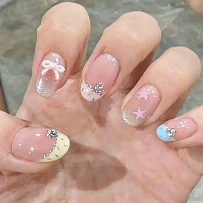 Artificial nail set with sparkling glitter accents Bowlift