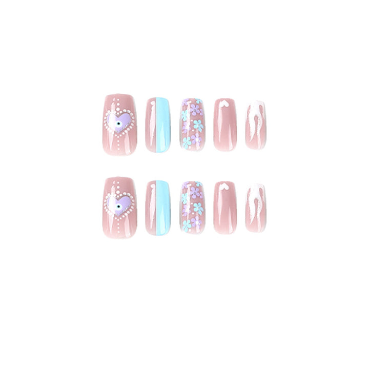 Artful nail art with floral accents and glitter embellishments Bowlift