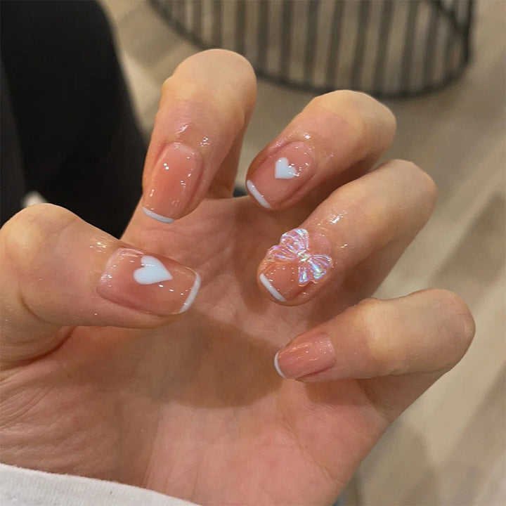 Nail art with heart and butterfly motifs Bowlift