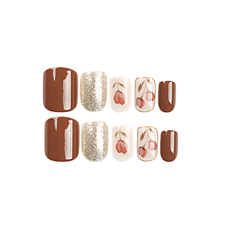 Artificial nail art with colorful flower design and glitter accents Bowlift