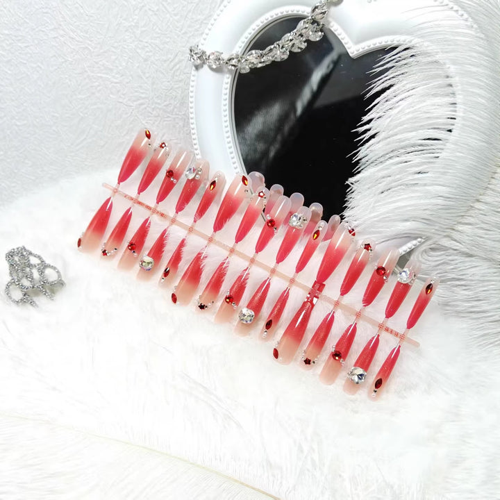 Glamorous artificial nails with sparkling ombre effect and elegant embellishments Bowlift
