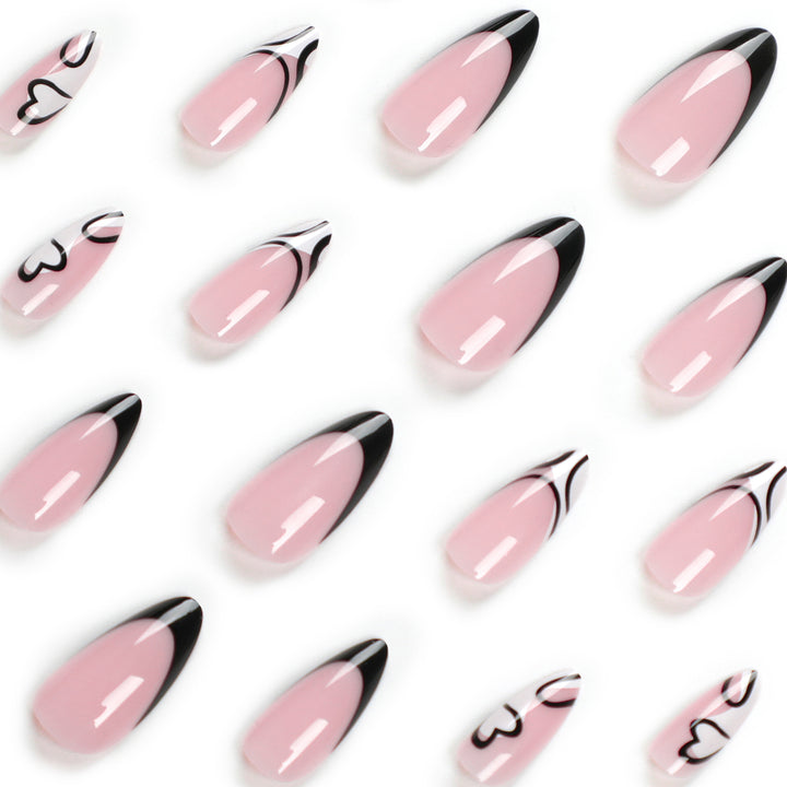 Artful stiletto nails with elegant black-and-white design Bowlift