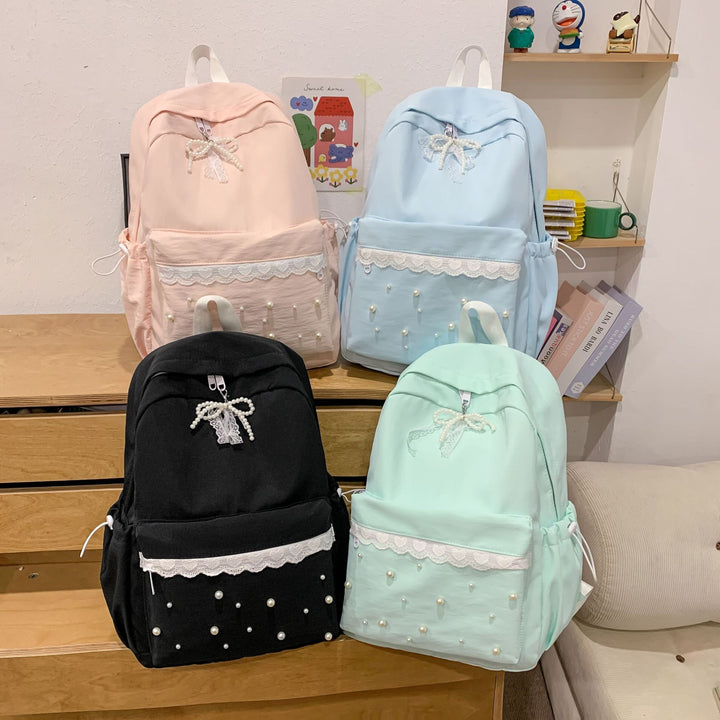 Backpack with elegant pearl applications and intricate design Bowlift