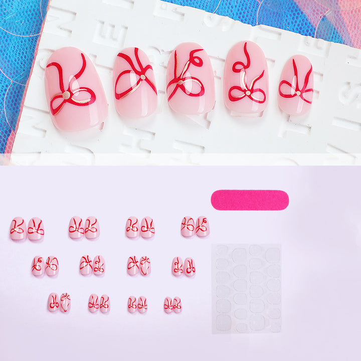 Artificial nail design with bow motifs Bowlift