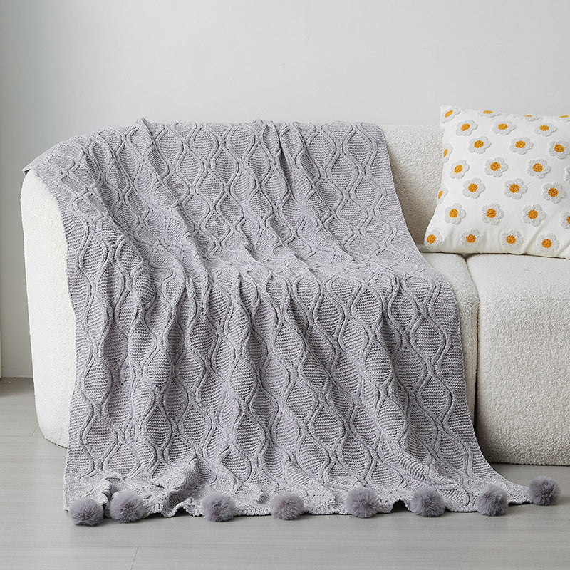 Ladies knit blanket with decorative pom poms Bowlift