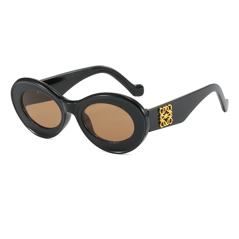 Women's fashionable sunglasses with oval frame and golden applications Bowlift