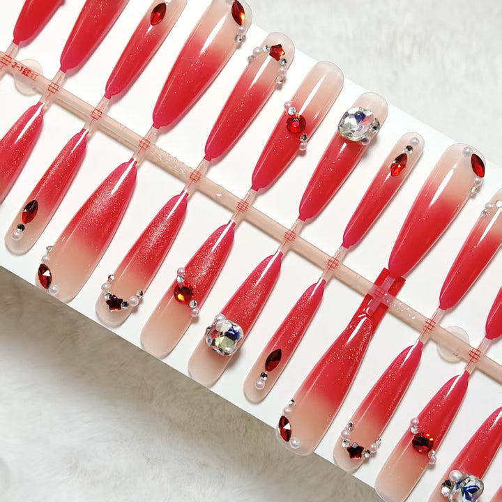 Glamorous artificial nails with sparkling ombre effect and elegant embellishments Bowlift