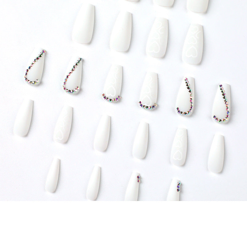 Artful Nail Extensions with Heart Design and Glitter Accents Bowlift