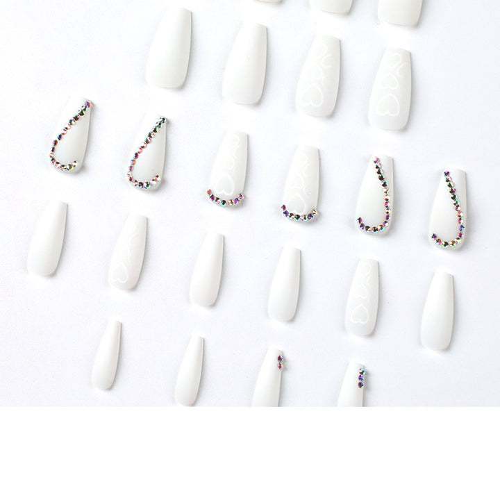 Artful Nail Extensions with Heart Design and Glitter Accents Bowlift