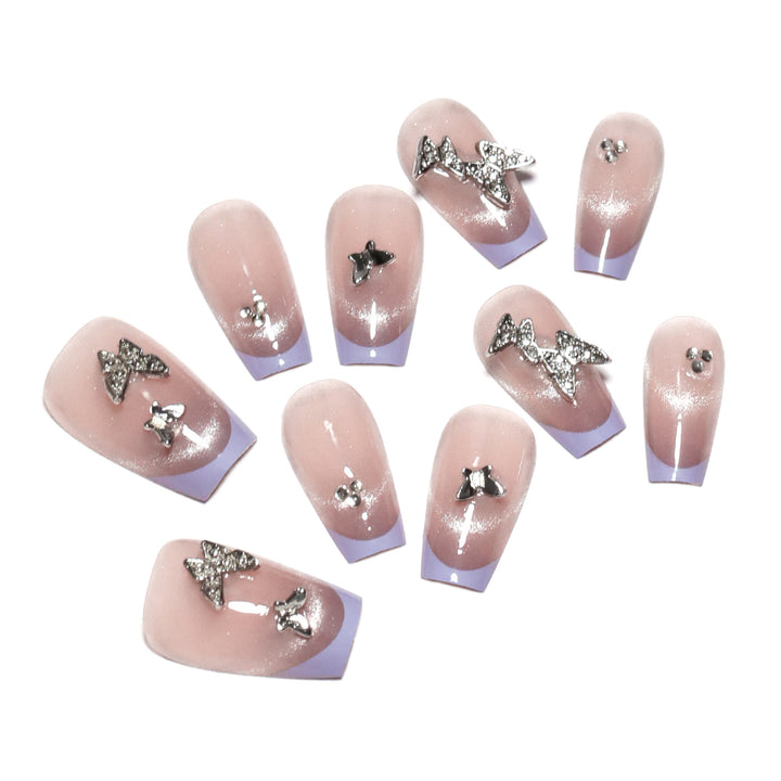 Artificial nail extensions with glitter design and elegant accents Bowlift