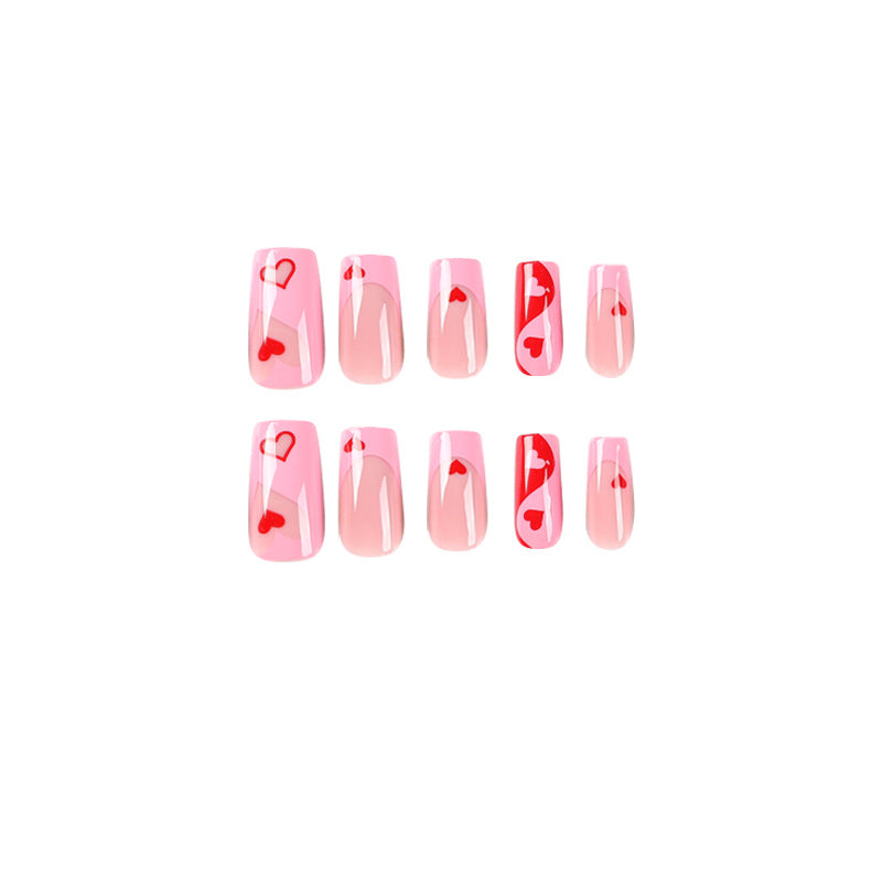Artificial nail art with heart design and glitter accents Bowlift