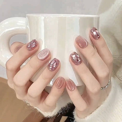 Artificial nails with glitter and crystal accents Bowlift