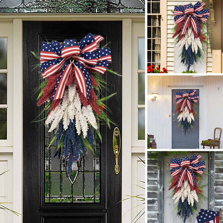 Independence Day tapering teardrop door swag with wired stars-and-stripes bow and textured faux floral sprays Bowlift