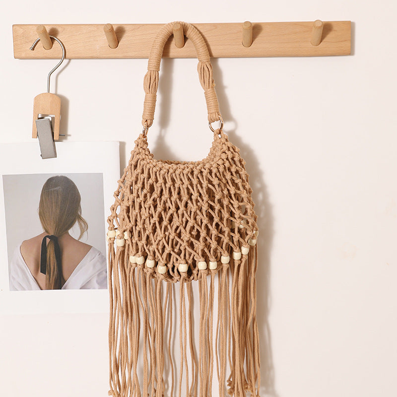Macrame bag with decorative fringes and wooden beads Bowlift