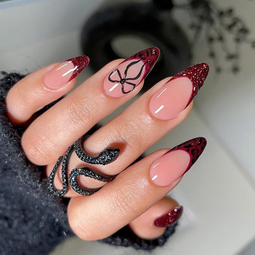 Artistic Stiletto Press-On Nails with Unique Black and Red Design Bowlift