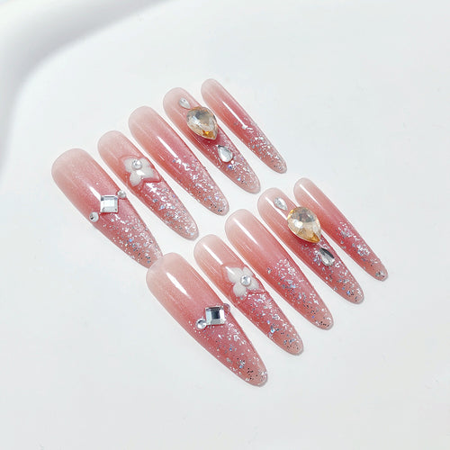 Shiny artificial nails with rhinestones and glitter Bowlift