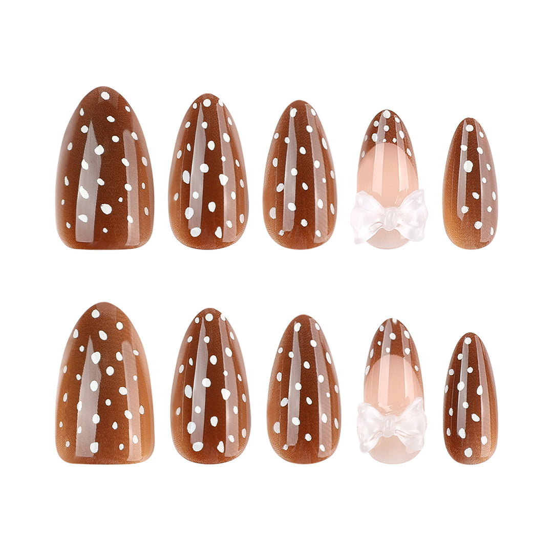 Artistic stiletto nails with delicate bow motif Bowlift