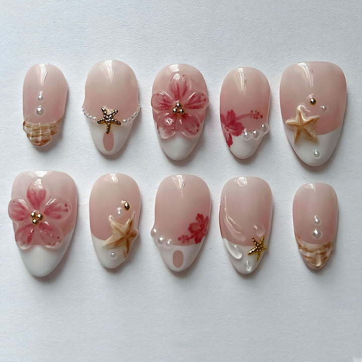 Elegant artificial nails with floral designs and glitter accents Bowlift
