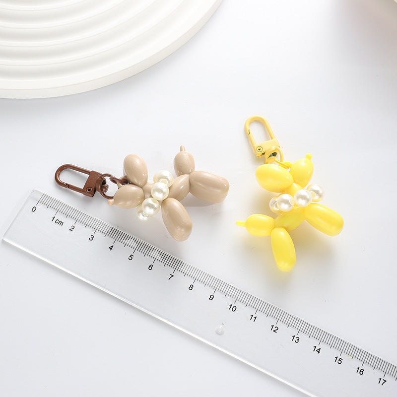Playful keychain with balloon dog and beads Bowlift