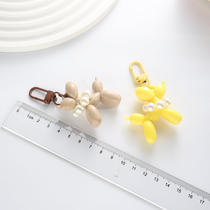 Playful keychain with balloon dog and beads Bowlift