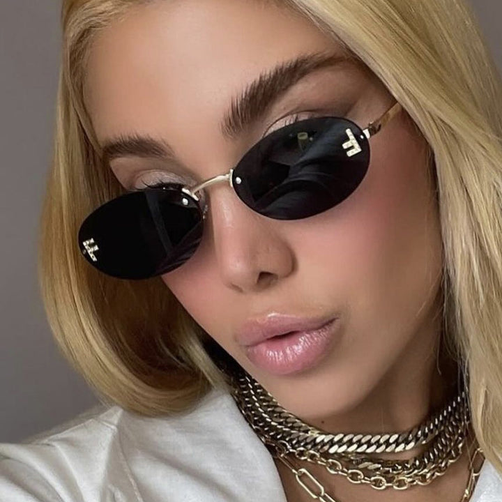 Women's fashionable sunglasses with elegant, round lenses and delicate metal frame Bowlift