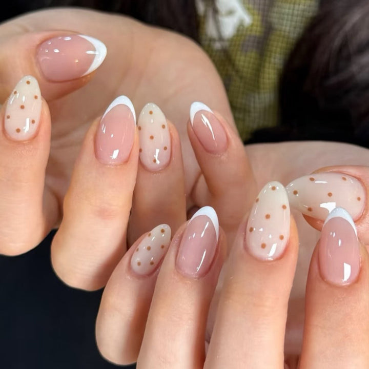 Artificial nail art with playful dots and bows Bowlift