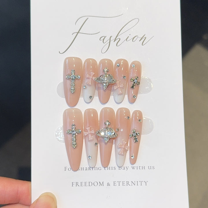 Acrylic nails with rhinestone embellished accents Bowlift