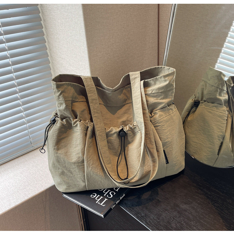 Practical everyday handbag with drawstring Bowlift