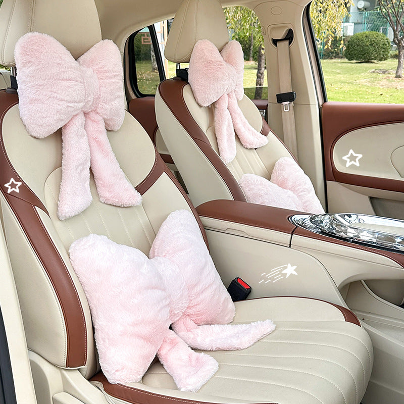 plush bow-shaped decorative throw cushion with long tails and faux-fur texture Bowlift