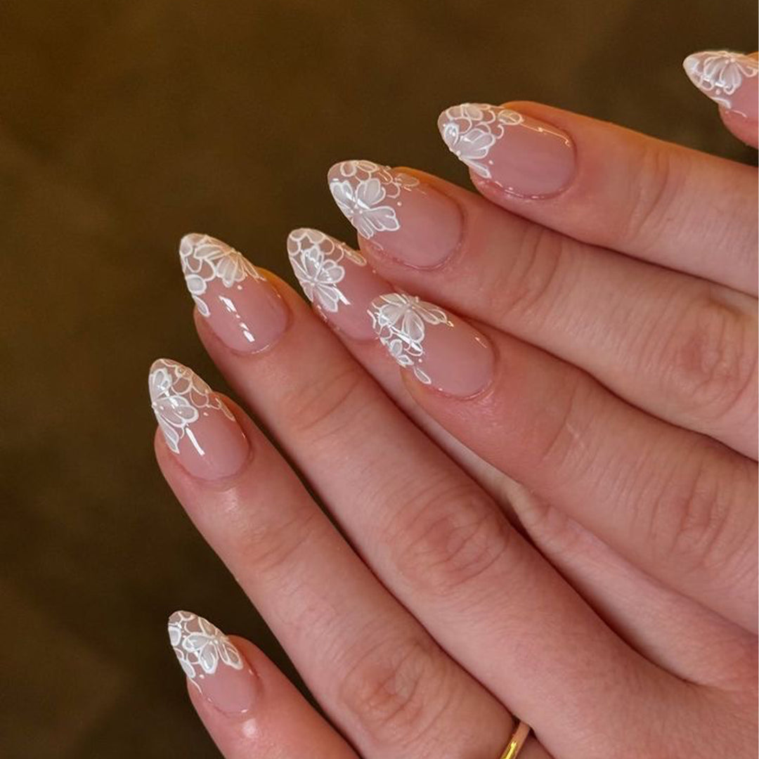 Artistic stiletto nails with floral embellishments Bowlift