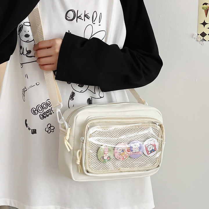 Shoulder bag with transparent viewing pocket and playful graphic design Bowlift