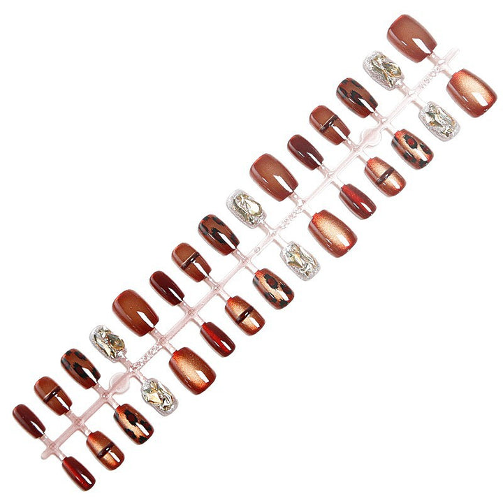 Glamorous artificial nails with animal design and glitter accents Bowlift