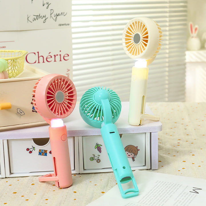 Women portable mini hand fan with integrated LED lighting and USB charging function Bowlift