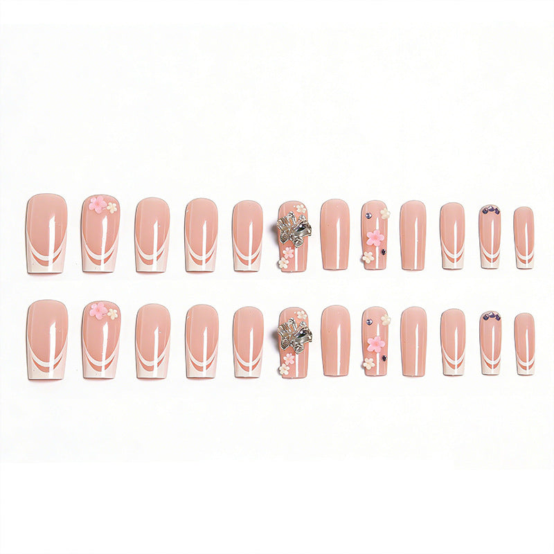 Artificial nails with floral accents and glitter effects Bowlift