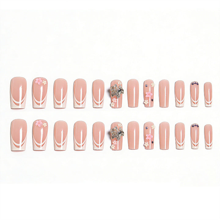 Artificial nails with floral accents and glitter effects Bowlift