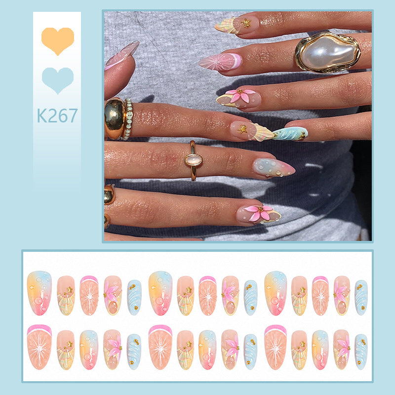 Artificial nails with creative flower and glitter detail Bowlift