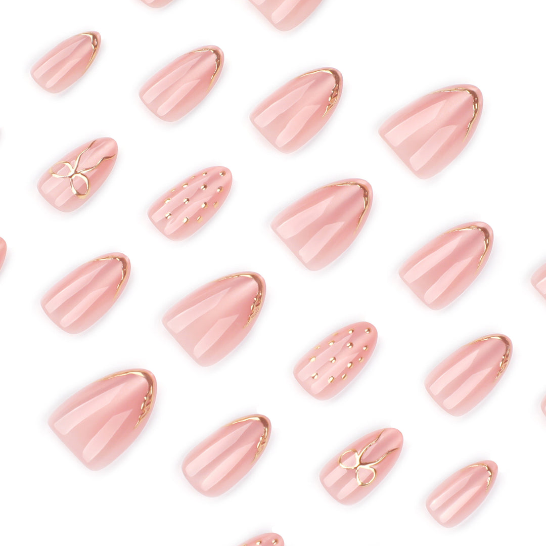 Artful nail extensions with elegant golden accents Bowlift