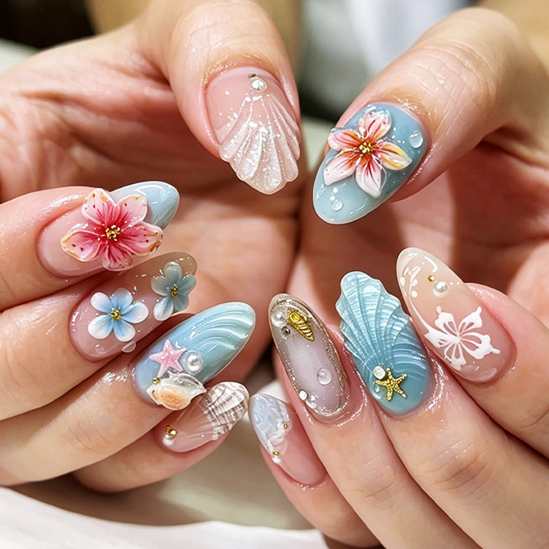 Artificial nail set with maritime motifs and colorful flowers Bowlift