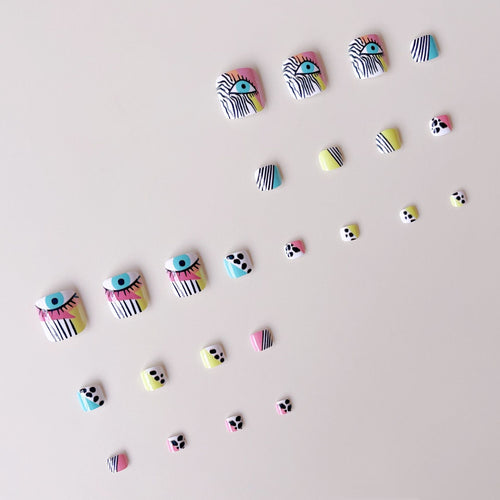 Artificial nail set with vibrant color accents and geometric patterns Bowlift