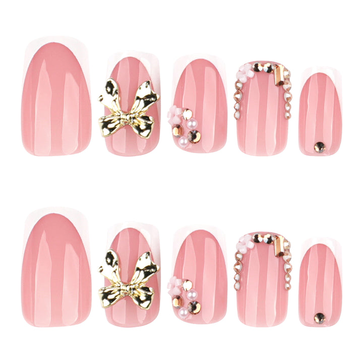 Elegant Nail Extensions with French Tips and Decorative Accents Bowlift