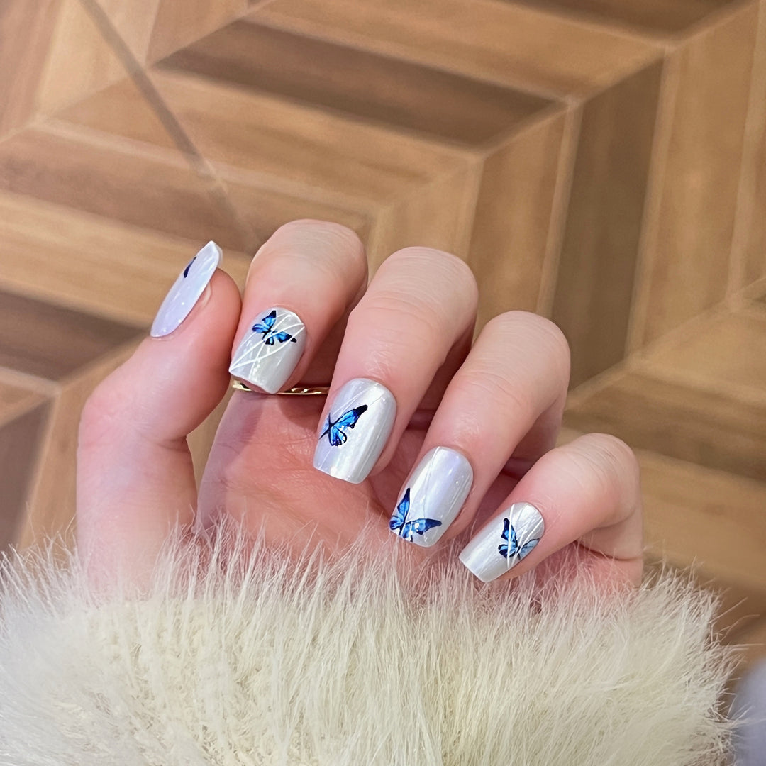 Creative nail extensions with intricate butterfly design Bowlift